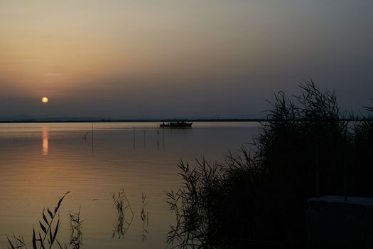 Reflections of the sunset in the lagoon. Sunset lights