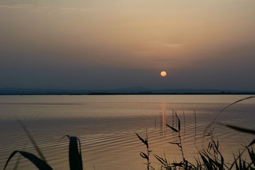 Reflections of the sunset in the lagoon. Sunset lights