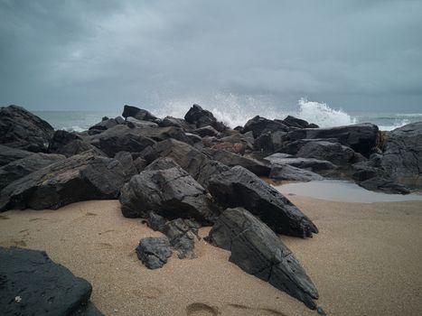 Rocks on the beach after the storm. Storm colors