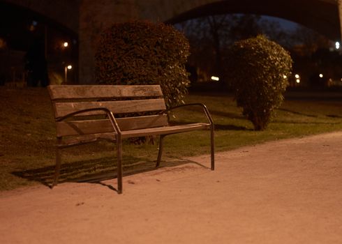 Lonely bench in the dark waiting for a friend.Loneliness and tranquility