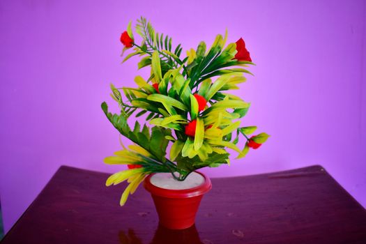 A colorful flower and leaf pot showpiece well decorated on a tool