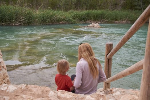 Mother and son watching the mighty river, Mothers love