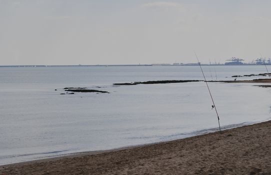 Fishing rods on the shore of the beach, Colors of nature