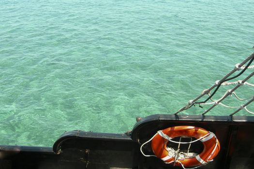 View of the Caribbean Sea from the deck of the ship.Turquoise waters and cloudless blue sky