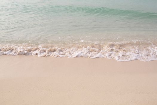 Small waves reaching the shore of the beach, Caribbean beach with turquoise waters