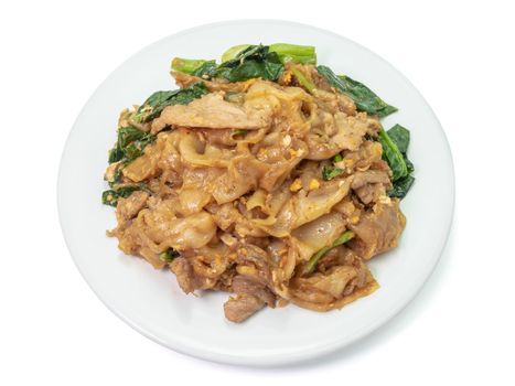 The close up of Fried Noodle with soy sauce on white plate on white background.