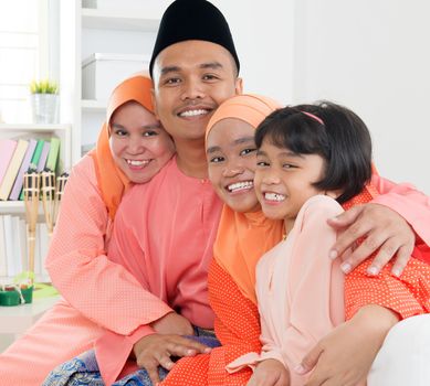 Asian Muslim Malay family at home. Malaysian people living lifestyle.