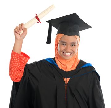 Female student in graduation gown, standing isolated white background.