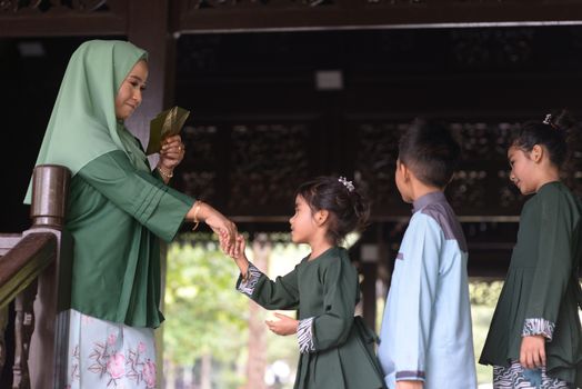 Muslim family greeting, Hari Raya Eid Al-Fitr concept. 