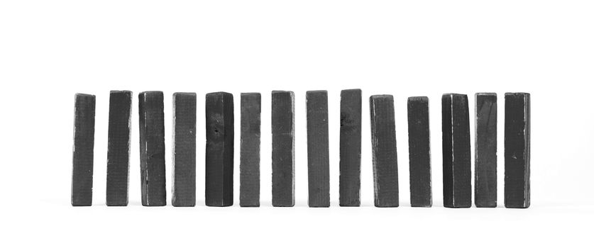 Row of vintage building blocks isolated on white background - Black