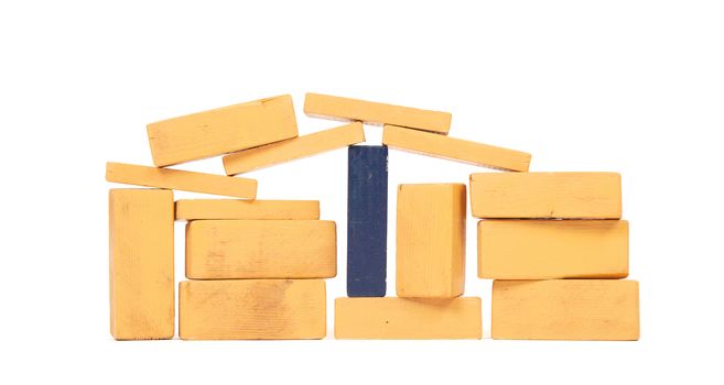 Vintage orange building blocks isolated on white background, one blue one