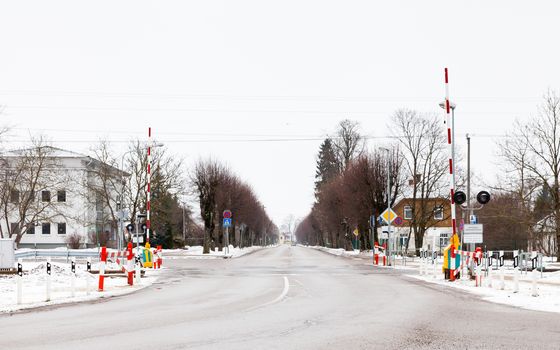 The view across  a railway level crossing in Sigulda.  Sigulda is a town in Latvia.