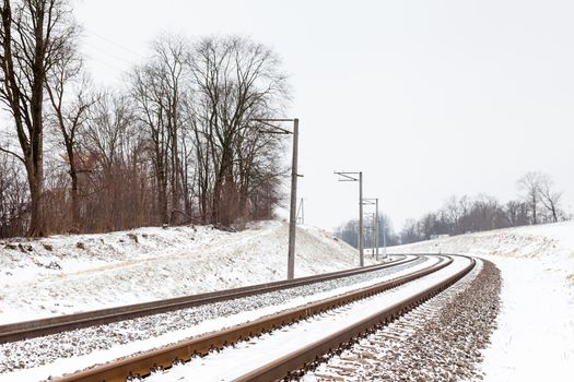 The view along a snow covered railway track in Sigulda, Latvia.