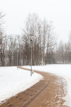 A winter view along a deserted pathway in Sigulda, Latvia.  Sigulda is a part of the Gauja National Park.