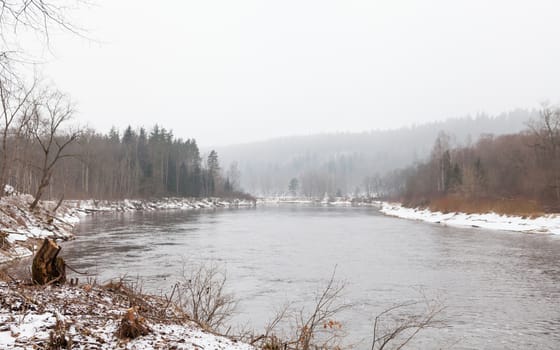 A winter view of the Gauja River near Sigulda, Latvia. Sigulda is a part of the Gauja National Park.