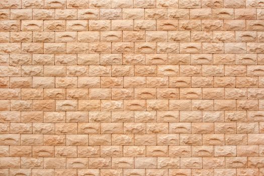 Orange beige rough bricks wall texture, background
