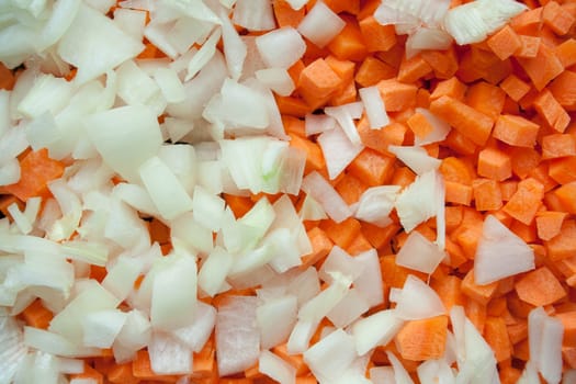 Carrot and onion cutted on top view background