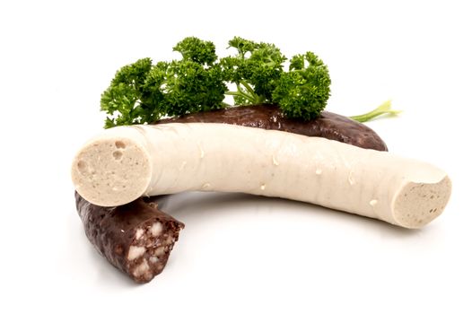Black and white pudding with parsley on a white background