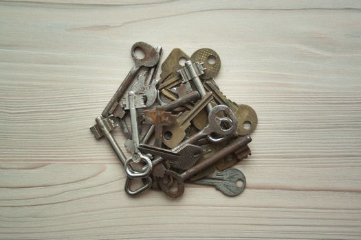 Close up heap of old rusty grunge keys top view. Many keys Access, security, enter, choice, solutions of problems concept, symbol