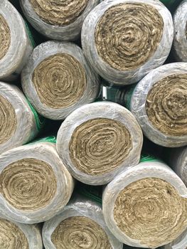 Many mineral wool bundles background. Insulation floor and walls concept