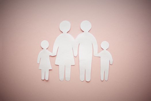 paper family cut out on bright pink background, family home, foster care, family mental health, homeschool education concept. 