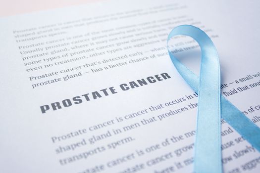 Prostate cancer quote on white paper list article with blue ribbon November Prostate Cancer Awareness month