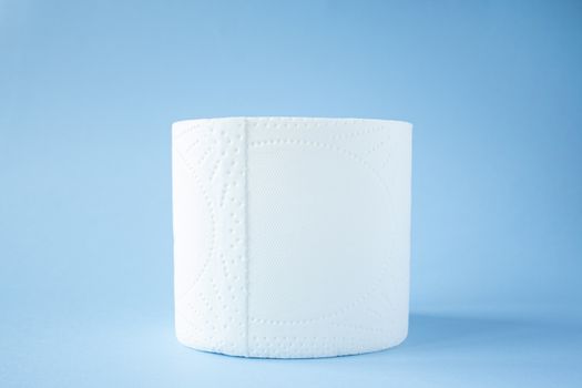Toilet paper roll on a blue background top view. Toilet paper purchase due to kronavirus concept. Personal hygiene and stopping the spread of the virus. Cleanliness, Hygiene, Sterility