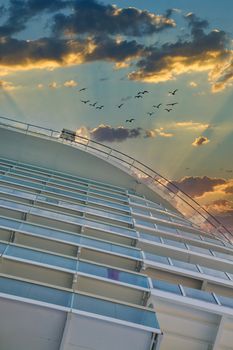 Rows of balconies on a luxury cruise ship into a nice sky