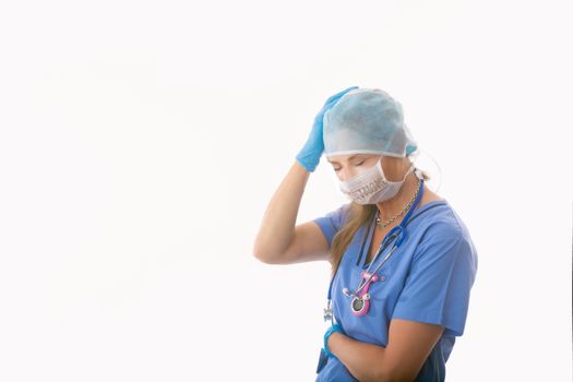 COVID-19 Stressed and overwhelmed or overworked hopsital nurse healthcare worker during coronavirus or flu pandemic