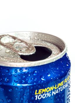 Condensation refreshing water droplets on the fresh cold soft drink can surface