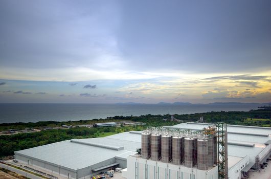 Wideview of under construction Large industrial mill in evening light