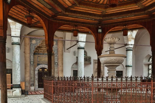 Sarajevo, Bosnia and Herzegovina - 27 February 2019: Inner fountain and carved door