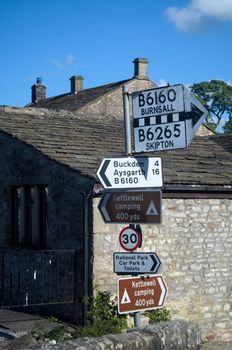 Signpost at a village crossroads in Kettlewell in the North Yorkshire Dales