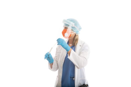 Doctor nurse or pathologist in full PPE P2 respirator mask and face shield holding a nose throat swab for COVID-19  or flu virus.  She is looking sideways for your message
