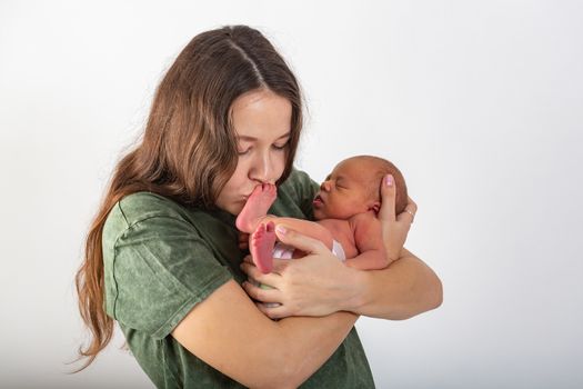 Mother and Baby kissing and hugging. Happy Family.