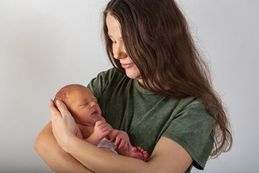 Mother and Baby kissing and hugging. Happy Family.