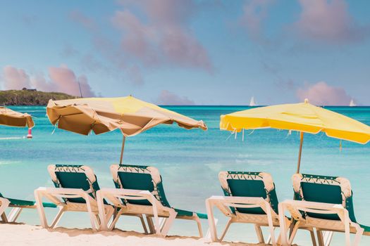 Chaise Lounges with Sun Umbrellas on a Beautiful Tropical Beach