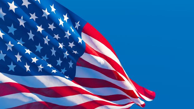 The national flag of the United States of America is flying in the wind.
