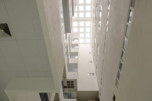 A Low vantage point in hall the high rise building, Looking up to the Daylight from the clerestory on the top of the building