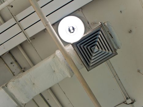 Mask of air duct and lamp on ceiling