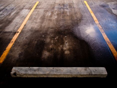 Wet floor of Carpark lene after the raining time