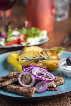 greek gyros with salad and ouzo