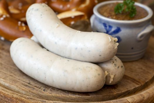 three bavarian white sausages with mustard