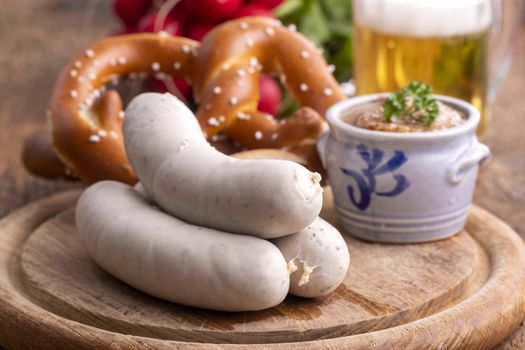 three bavarian white sausages with mustard