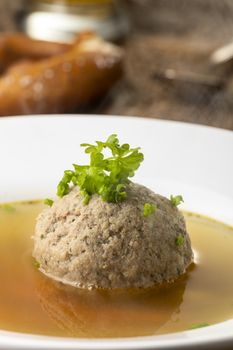 bavarian liver dumpling soup on wood