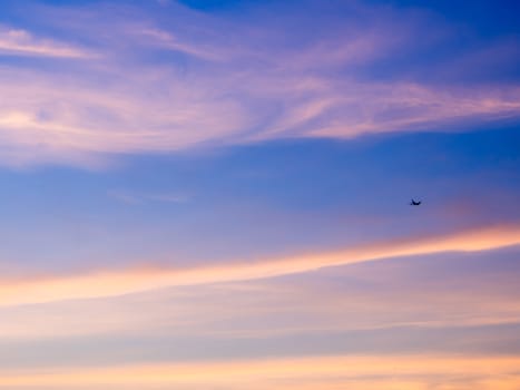 White fluffy clouds in the blue sky with morning light from the sunrise