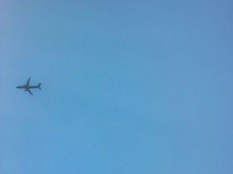 Aeroplane flyin at blue sky
