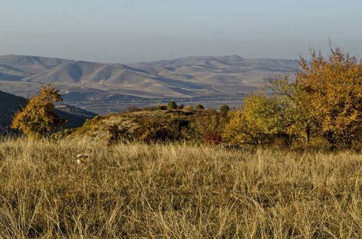 Amazing autumn view of glade, hill, forest with deciduous trees  near to pretty village Zhrebichko, Bratsigovo municipality,  Rhodope mountains, Bulgaria