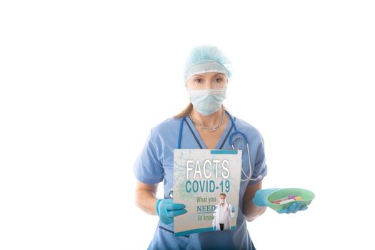 A nurse, pathologist or hospital worker holds a fact brochure and kidnes dish with blood tubes during the COVID-19 influenza coronabirus pandemic