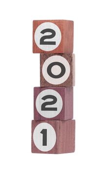 Four isolated hardwood toy blocks on white, saying 2021